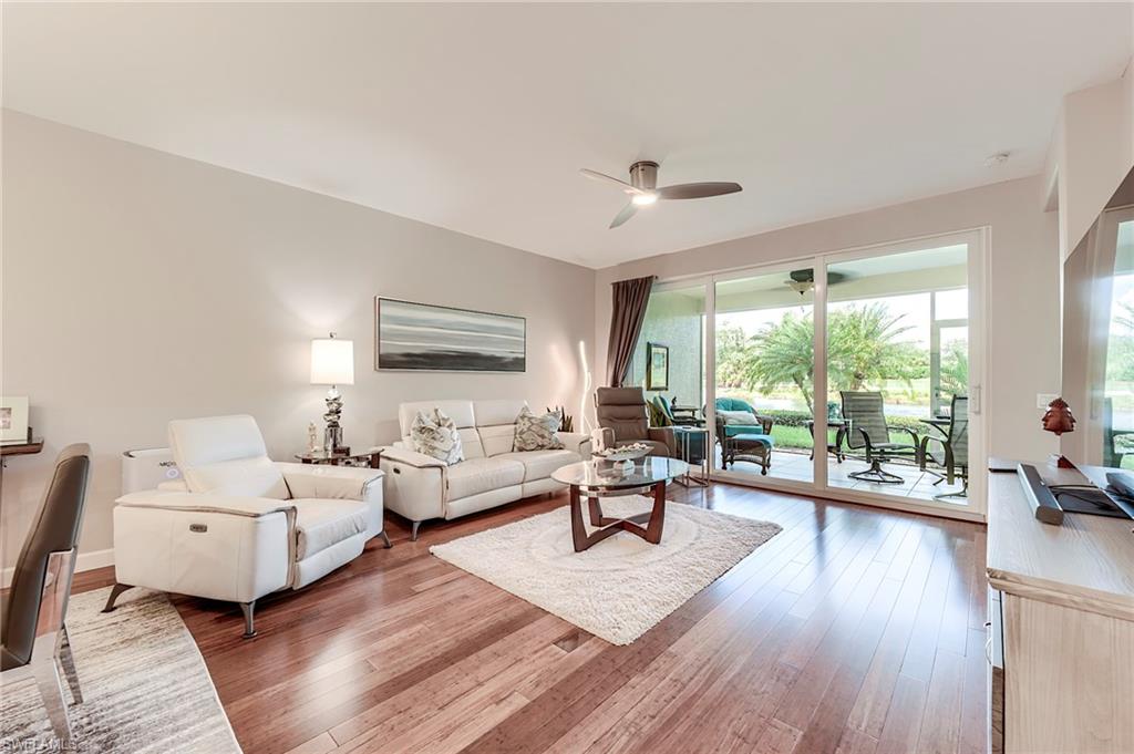 23815 Clear Spring Court, Unit 2105 Estero, FL 34135 - Photo 8 of 37 a living room with furniture and a large window