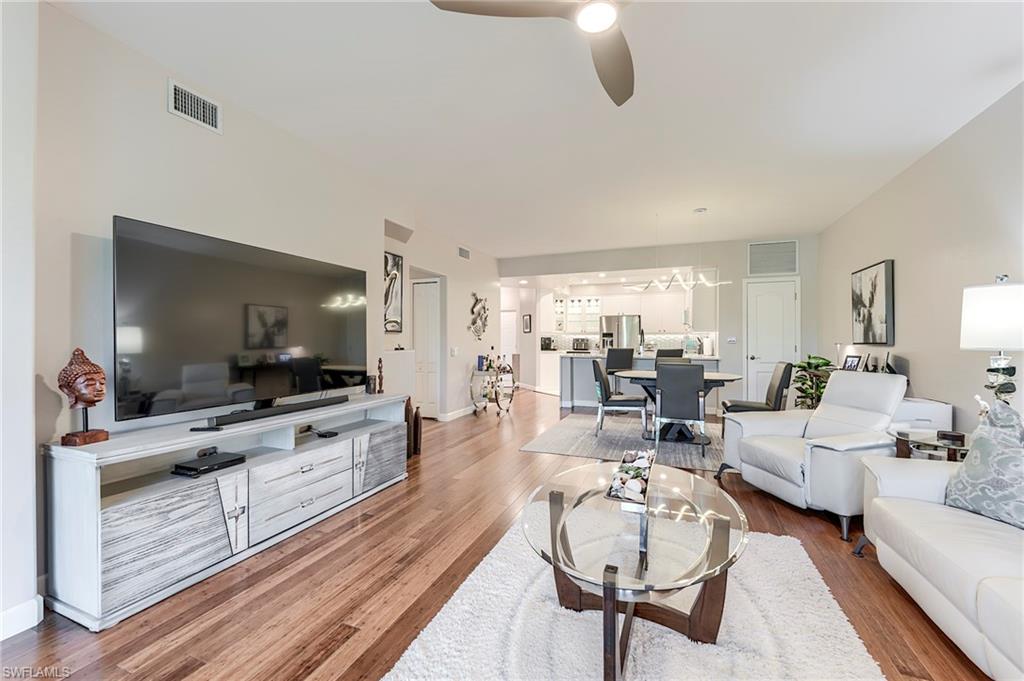 23815 Clear Spring Court, Unit 2105 Estero, FL 34135 - Photo 10 of 37 a living room with furniture and a flat screen tv