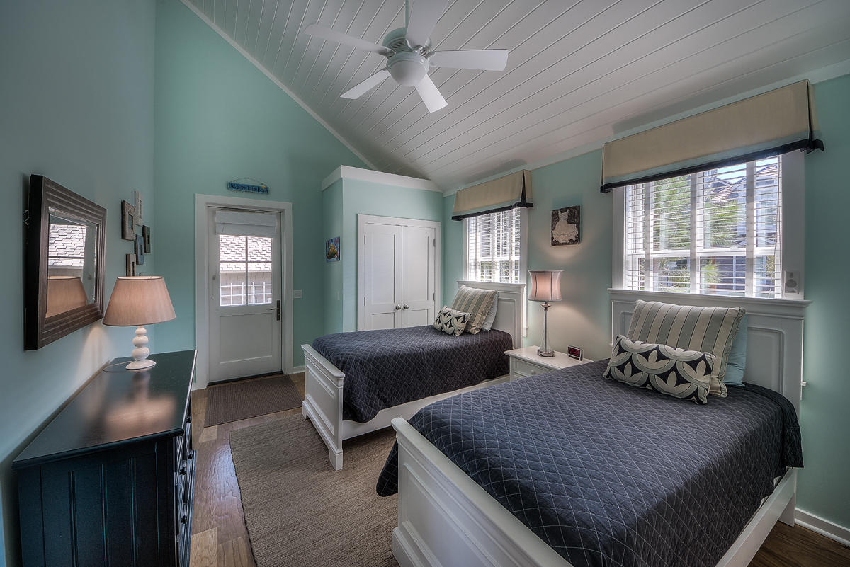 295 Salt Lane Inlet Beach, FL 32461 - Photo 13 of 26 a bedroom with a bed and wooden floor