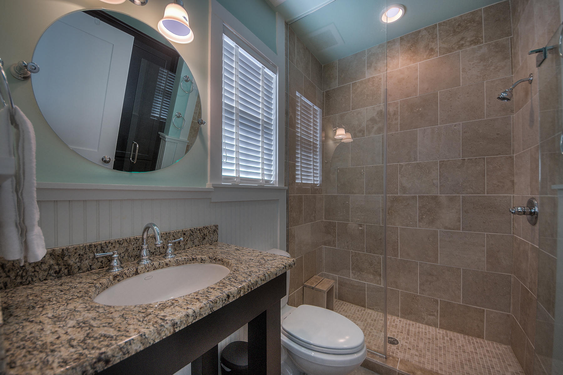 295 Salt Lane Inlet Beach, FL 32461 - Photo 14 of 26 a bathroom with a granite countertop sink a toilet and mirror