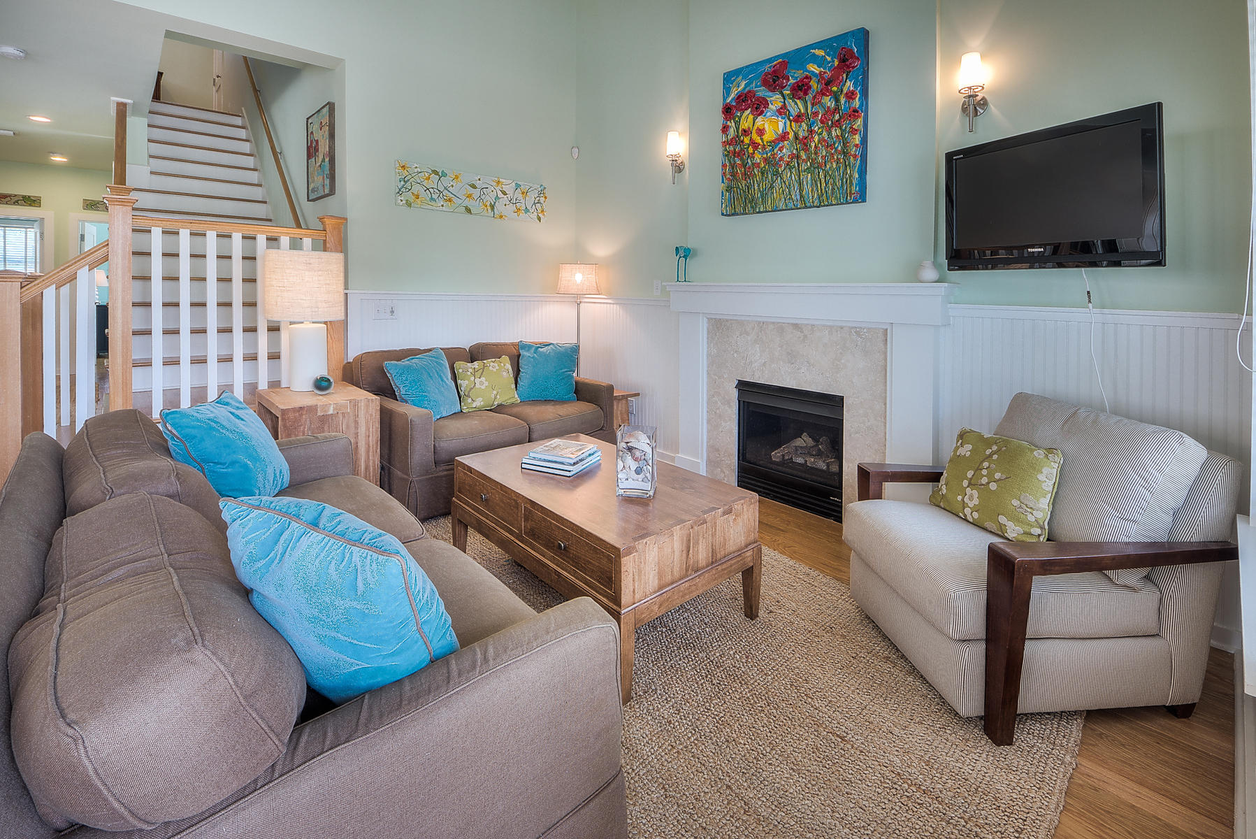 295 Salt Lane Inlet Beach, FL 32461 - Photo 15 of 26 a living room with furniture a flat screen tv and a fireplace