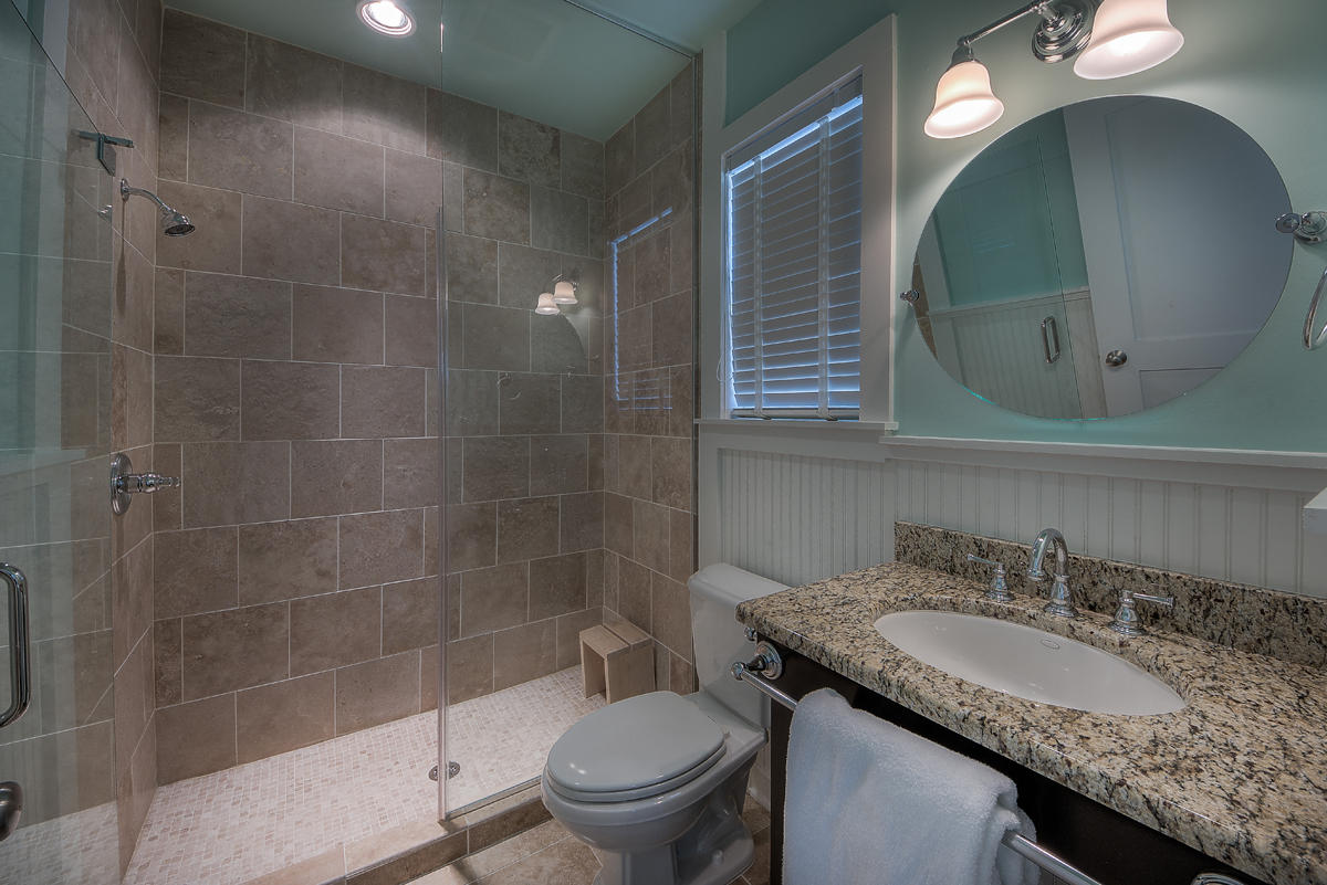 295 Salt Lane Inlet Beach, FL 32461 - Photo 21 of 26 a bathroom with a granite countertop sink a toilet and a mirror