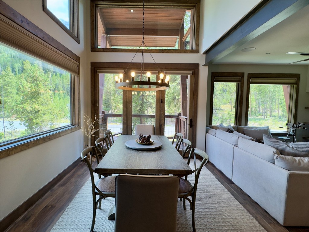 Walls of glass with vaulted  ceiling and transom window above