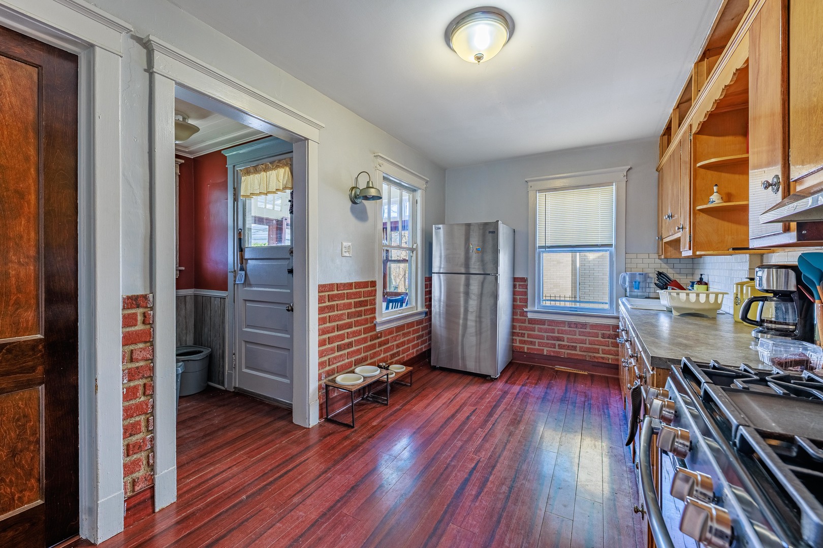 410 Repton Road Riverside, IL 60546 - Photo 8 of 30 a view of a hallway with wooden floor and stairs