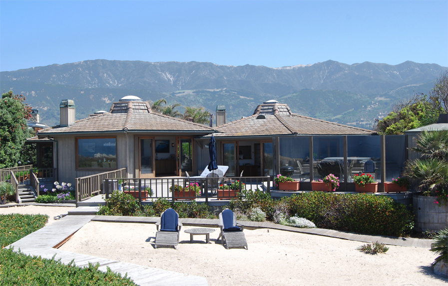815 Sand Point Road Carpinteria, CA 93013 - Photo 4 of 12 a front view of a house with a yard garden and outdoor seating