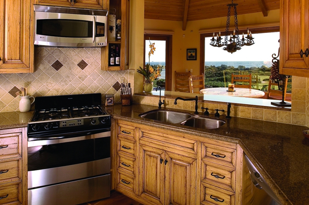 815 Sand Point Road Carpinteria, CA 93013 - Photo 6 of 12 a kitchen with a stove and a microwave