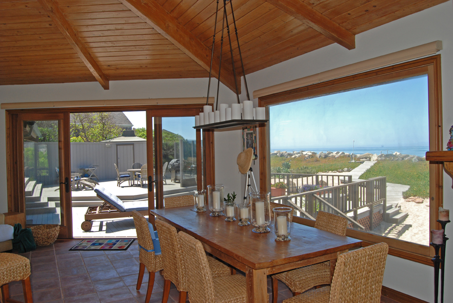 815 Sand Point Road Carpinteria, CA 93013 - Photo 7 of 12 a view of swimming pool with a table and chairs