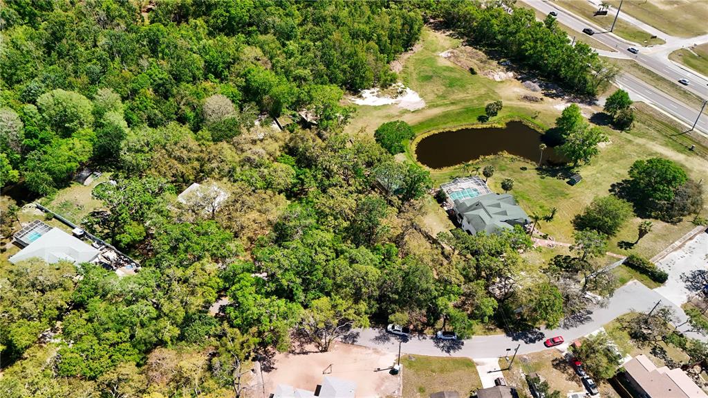 9240 Creston Avenue New Port Richey, FL 34654 - Photo 38 of 39 an aerial view of a house with a yard