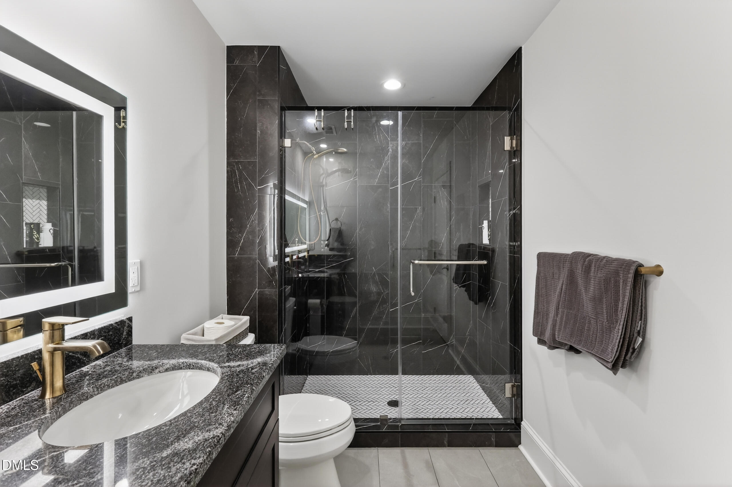 261 Character Drive Rolesville, NC 27571 - Photo 56 of 77 a bathroom with a granite countertop sink toilet and shower