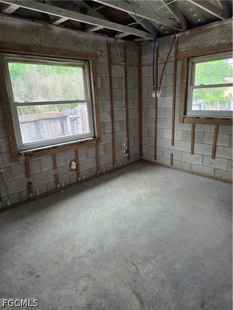 a view of an empty room with a window