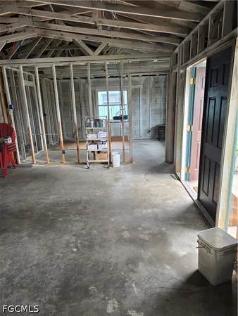 a view of water heater room with wooden floor