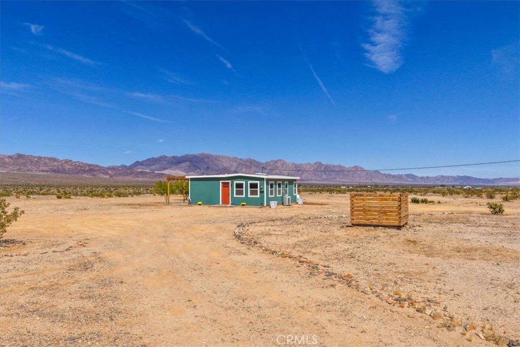 84320 McCombie Road Twentynine Palms, CA 92277 - Photo 2 of 57 a view of an ocean & house and a yard