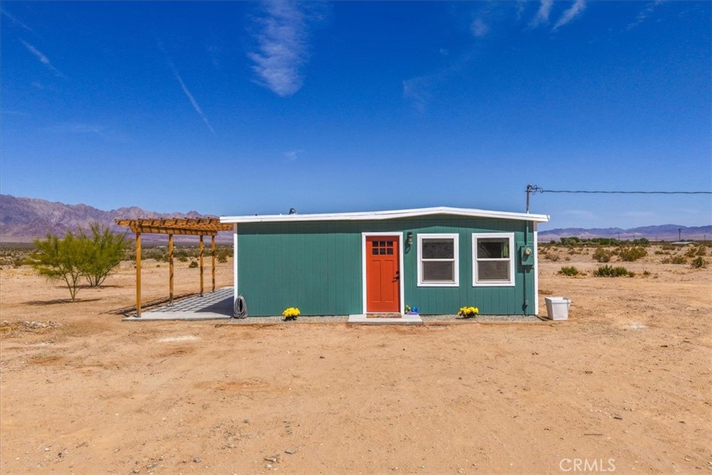 84320 McCombie Road Twentynine Palms, CA 92277 - Photo 3 of 57 a view of a house with a yard