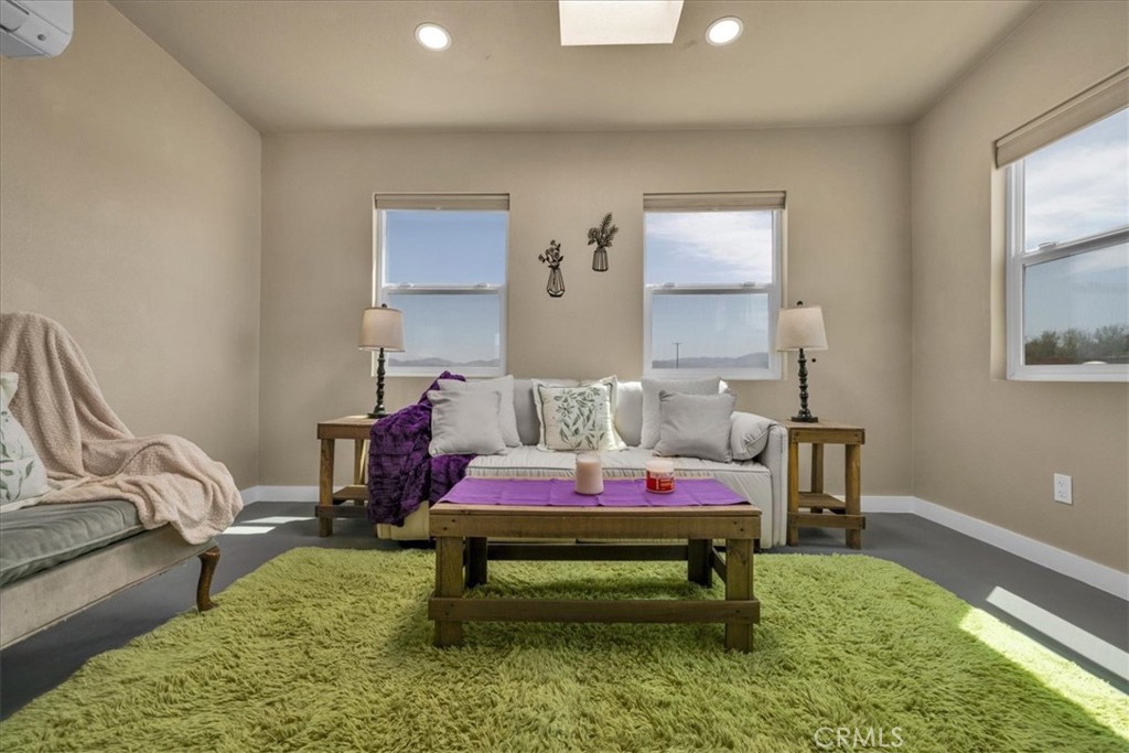 84320 McCombie Road Twentynine Palms, CA 92277 - Photo 8 of 57 a bedroom with a bed and a table