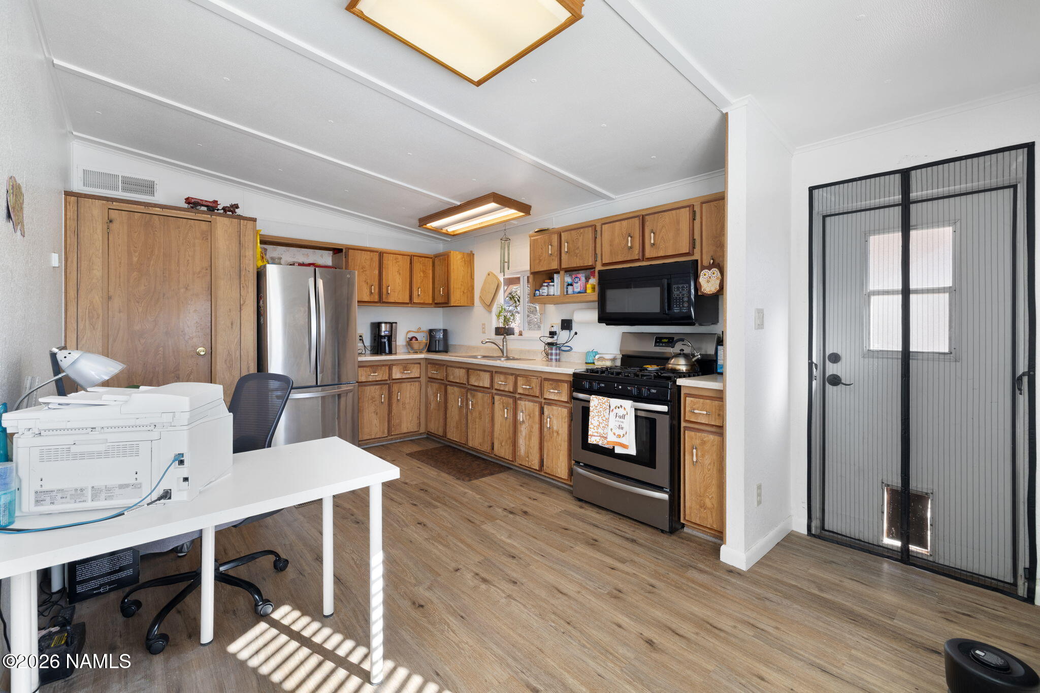 1050 North Arpt Road Williams, AZ 86046 - Photo 14 of 29 a kitchen with a sink stainless steel appliances and cabinets