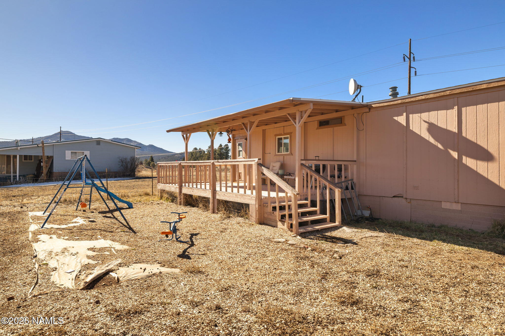 1050 North Arpt Road Williams, AZ 86046 - Photo 24 of 29 a house with trees in front of it