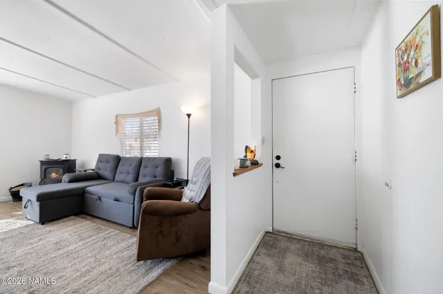 a living room with furniture and a gate