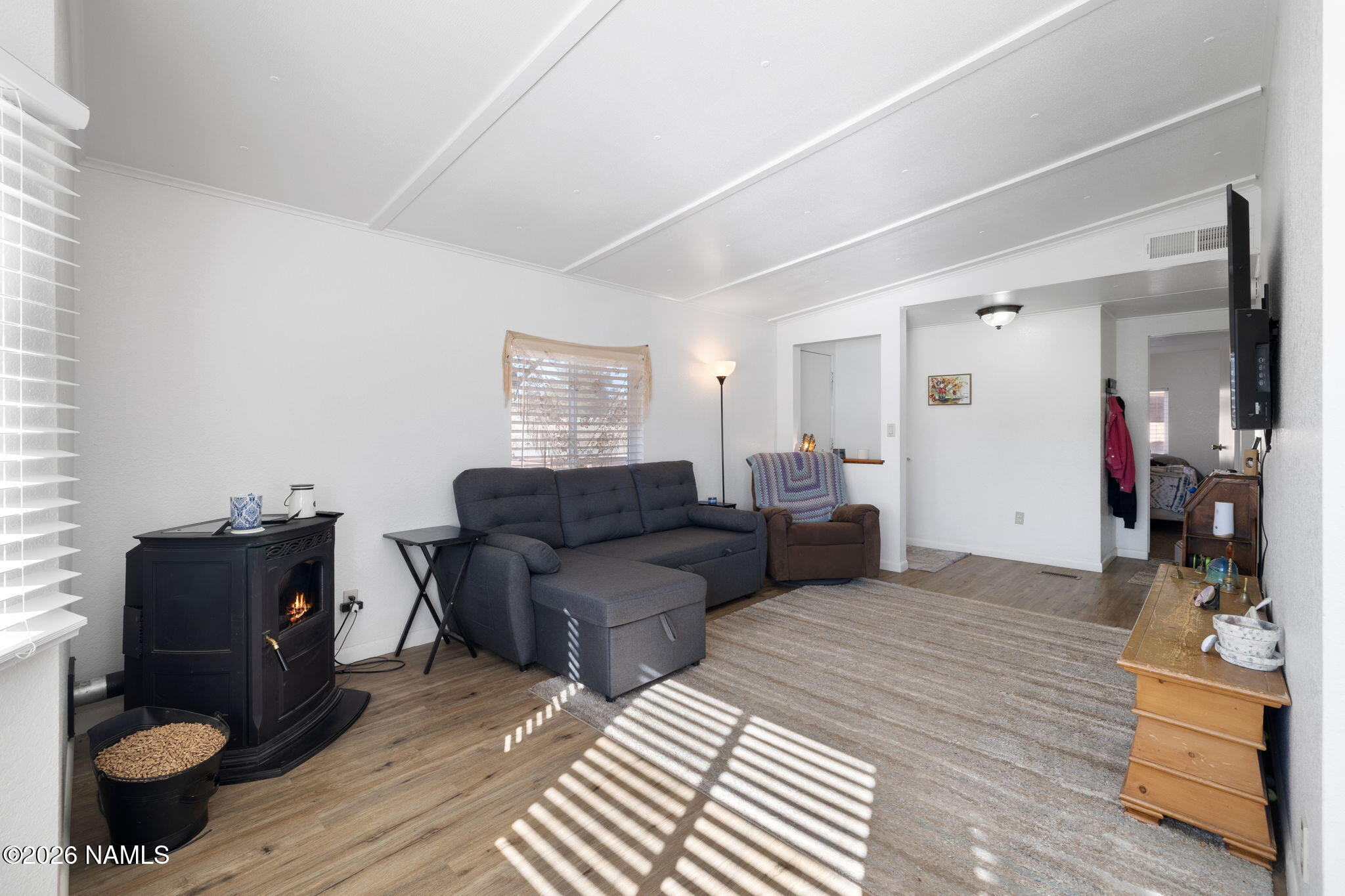 1050 North Arpt Road Williams, AZ 86046 - Photo 6 of 29 a living room with furniture and a wooden floor