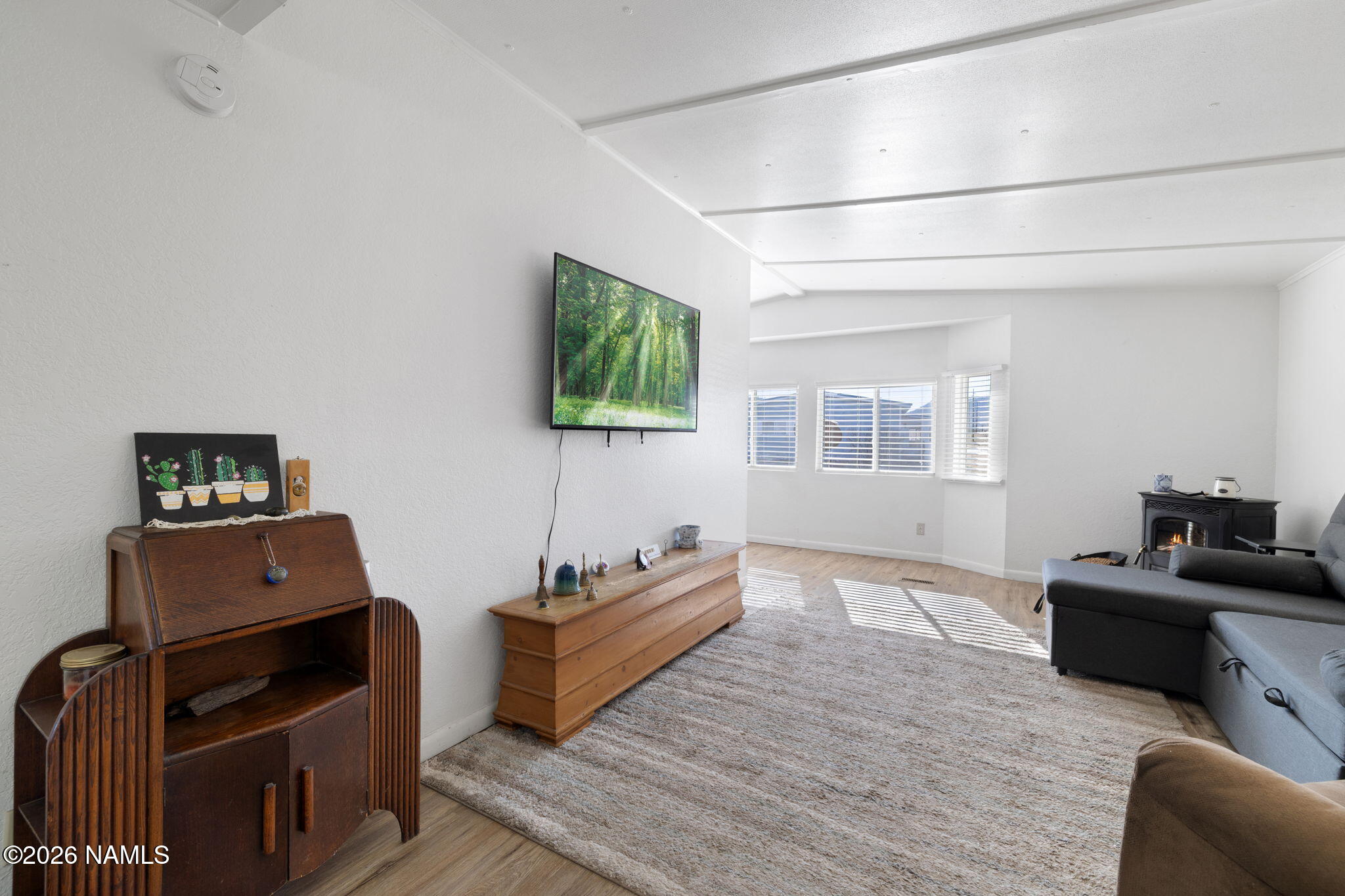 1050 North Arpt Road Williams, AZ 86046 - Photo 7 of 29 a living room with furniture and a flat screen tv