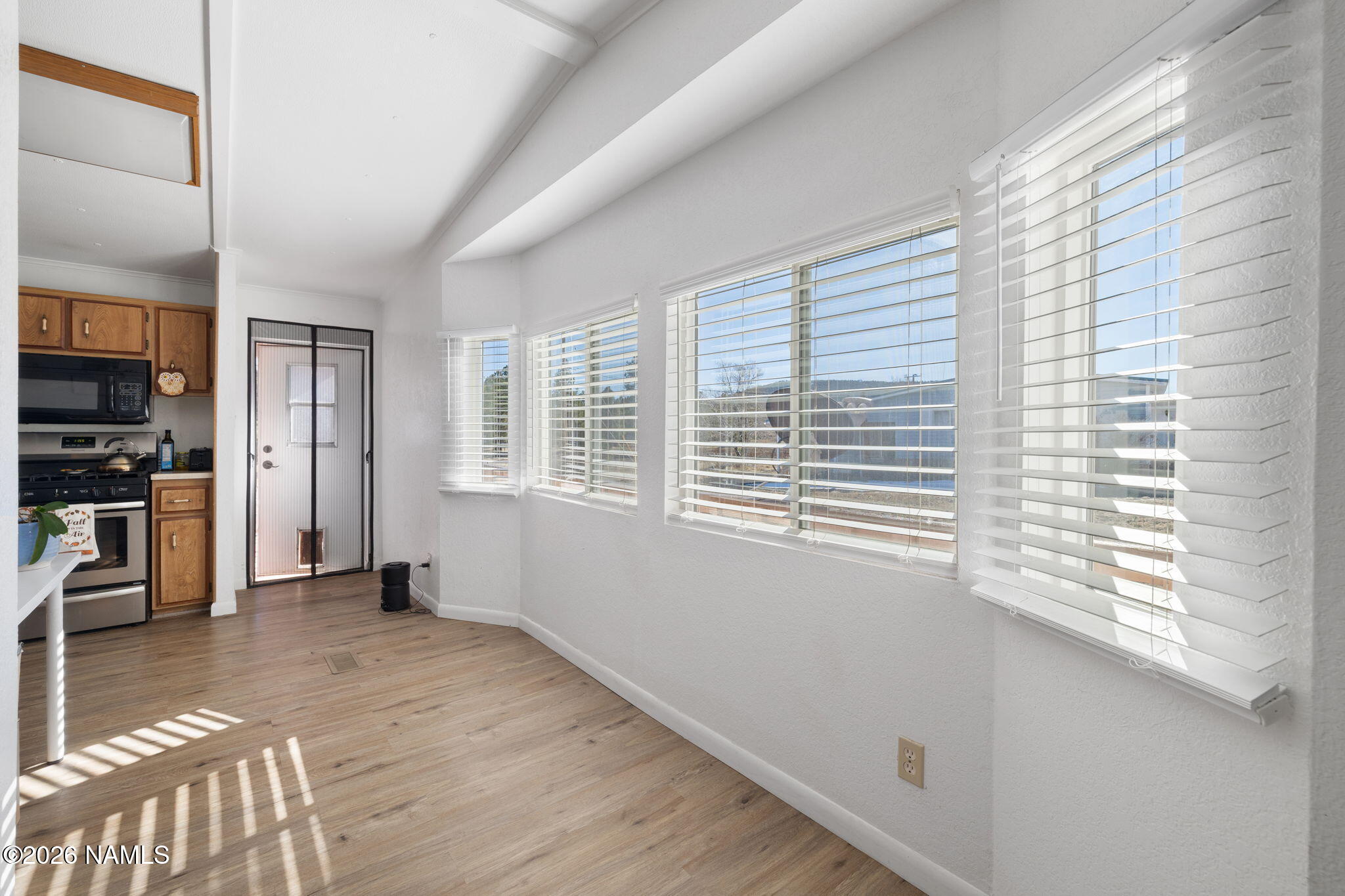 1050 North Arpt Road Williams, AZ 86046 - Photo 9 of 29 a view of a kitchen with a window