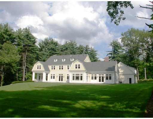 15 Walnut Road Weston, MA 02493 - Photo 2 of 10 a front view of a house with a garden