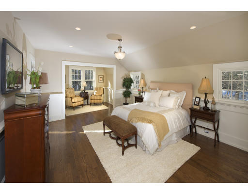 15 Walnut Road Weston, MA 02493 - Photo 5 of 10 a spacious bedroom with a large bed and a chandelier