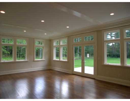 15 Walnut Road Weston, MA 02493 - Photo 8 of 10 a view of empty room with wooden floor and fan