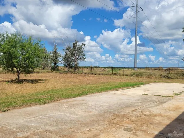 a view of backyard with cabin