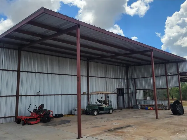 a view of a yard with a tree
