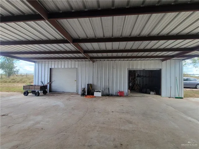 a view of an empty room with a fireplace