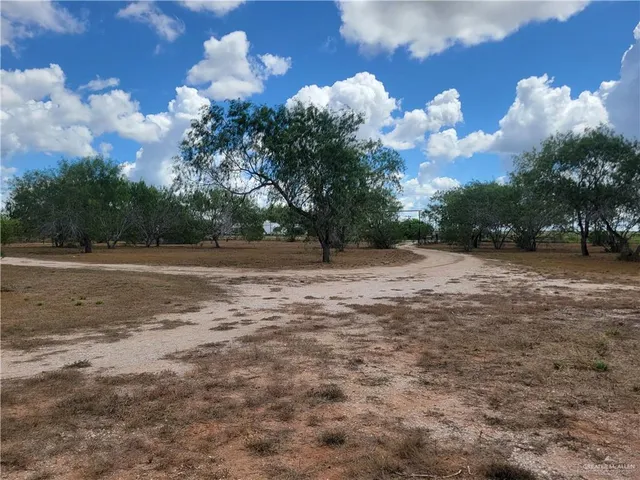 a view of a golf course with green space