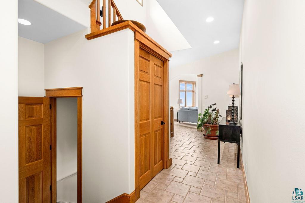 4856 Kingston Street Duluth, MN 55804 - Photo 16 of 88 Hallway featuring wood panel doors, light wood trim, and recessed lighting