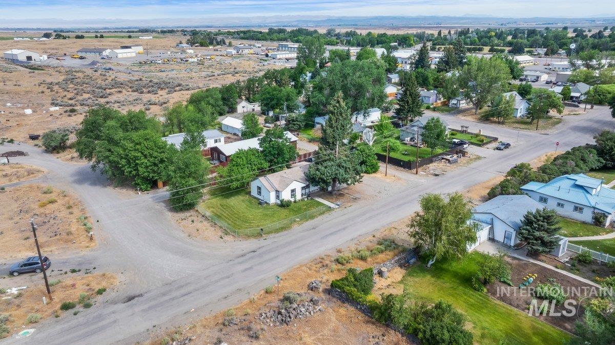 418 South Date Street Shoshone, ID 83352 - Photo 28 of 36 Aerial perspective showcasing a residential neighborhood with mixed landscaping