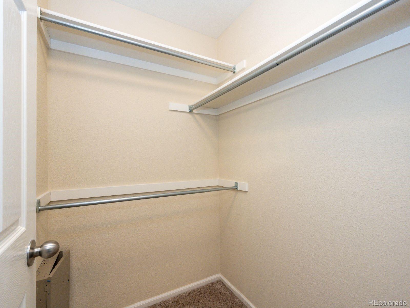5255 Memphis Street, Unit 122 Denver, CO 80239 - Photo 17 of 26 a view of a room with racks on the wall