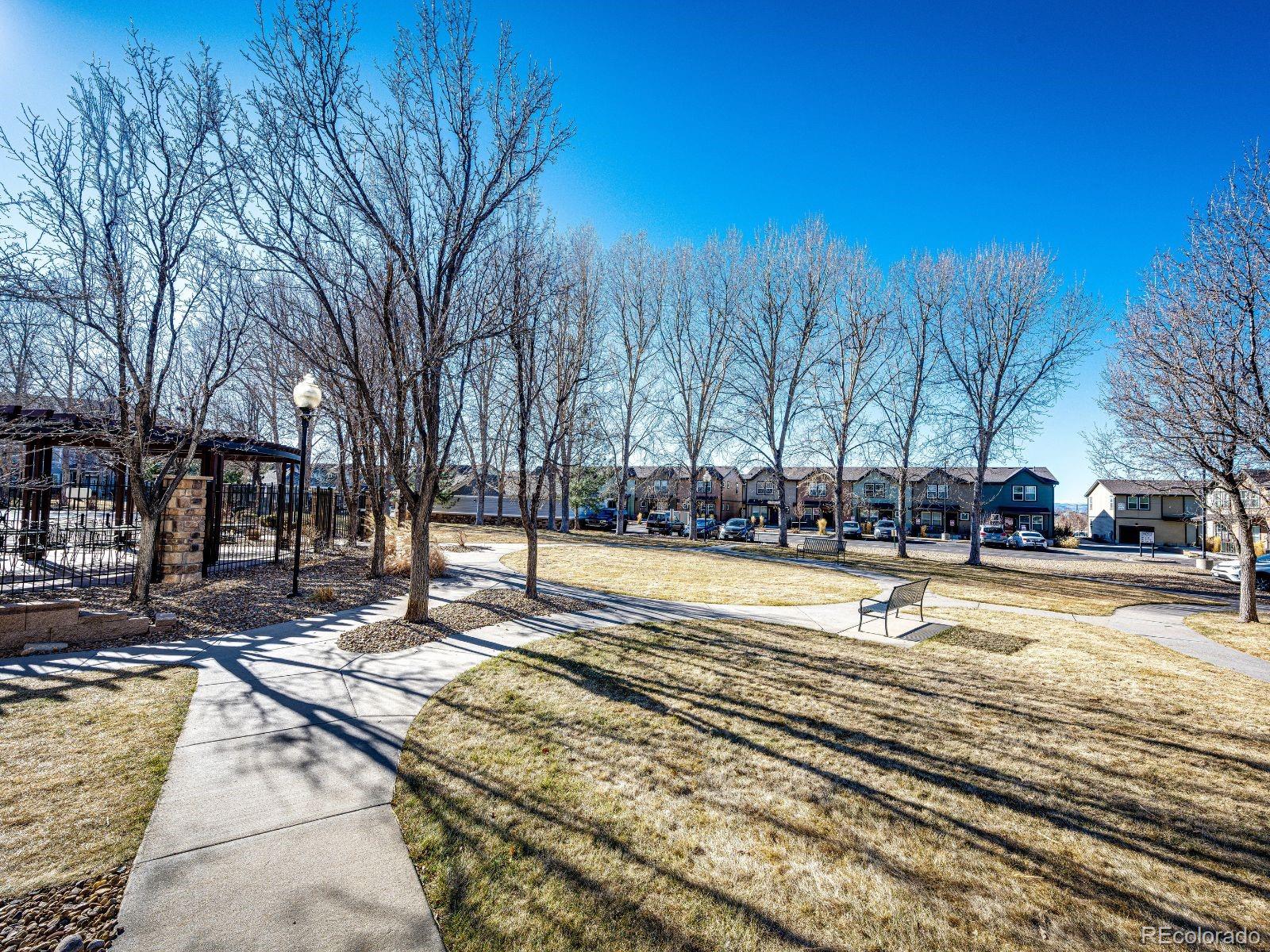 5255 Memphis Street, Unit 122 Denver, CO 80239 - Photo 25 of 26 a view of a swimming pool with trees