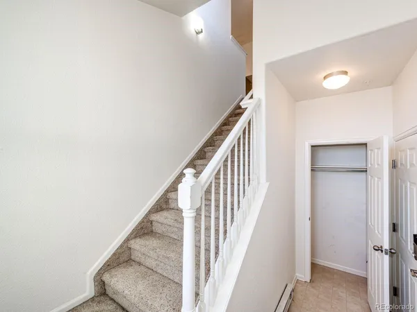 a view of a hallway with staircase