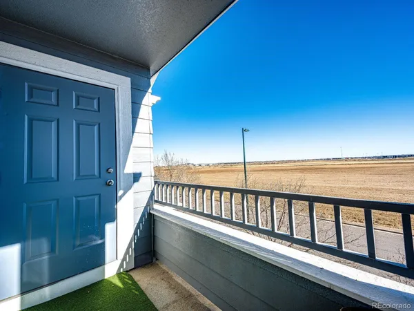 a view of balcony with furniture