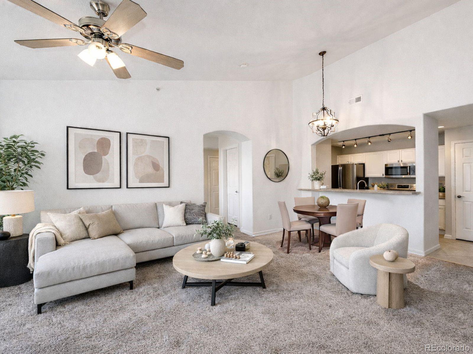 5255 Memphis Street, Unit 122 Denver, CO 80239 - Photo 9 of 26 a living room with furniture and a large window
