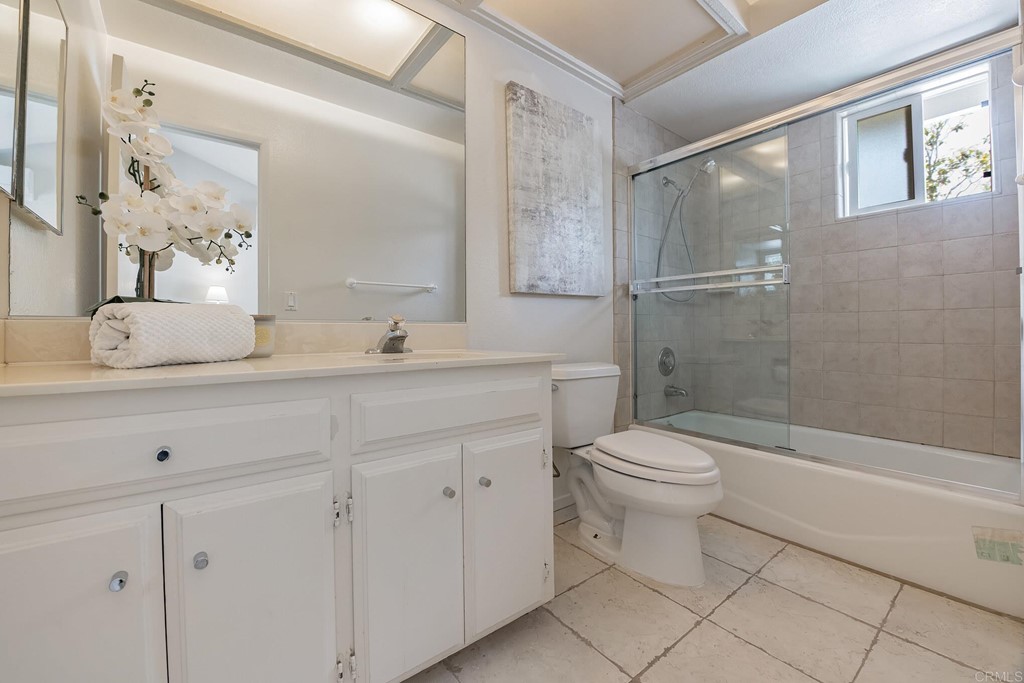 3112 Via De Caballo Encinitas, CA 92024 - Photo 12 of 31 a bathroom with a sink a toilet and shower