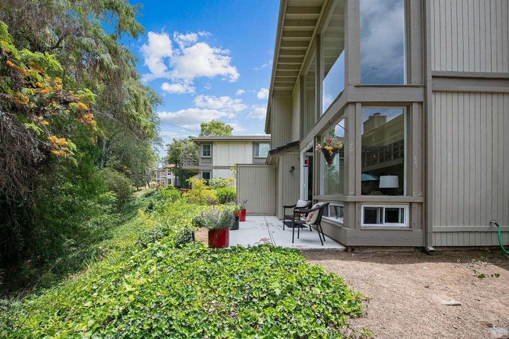 3112 Via De Caballo Encinitas, CA 92024 - Photo 14 of 31 a front view of a house with a yard