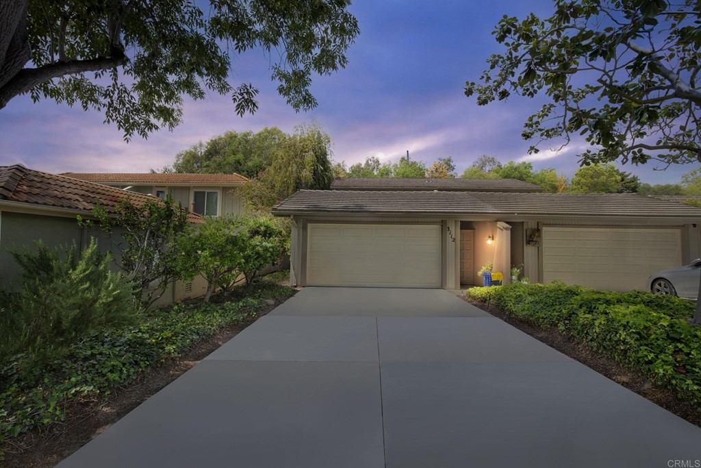 3112 Via De Caballo Encinitas, CA 92024 - Photo 15 of 31 a front view of a house with a yard and garage