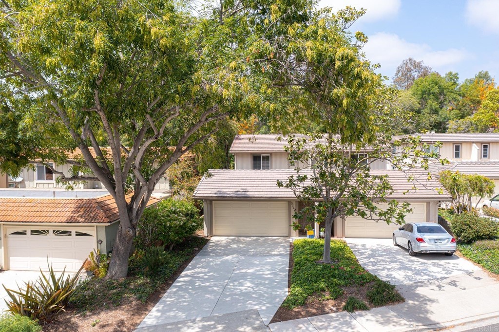 3112 Via De Caballo Encinitas, CA 92024 - Photo 22 of 31 a front view of a house with a garden