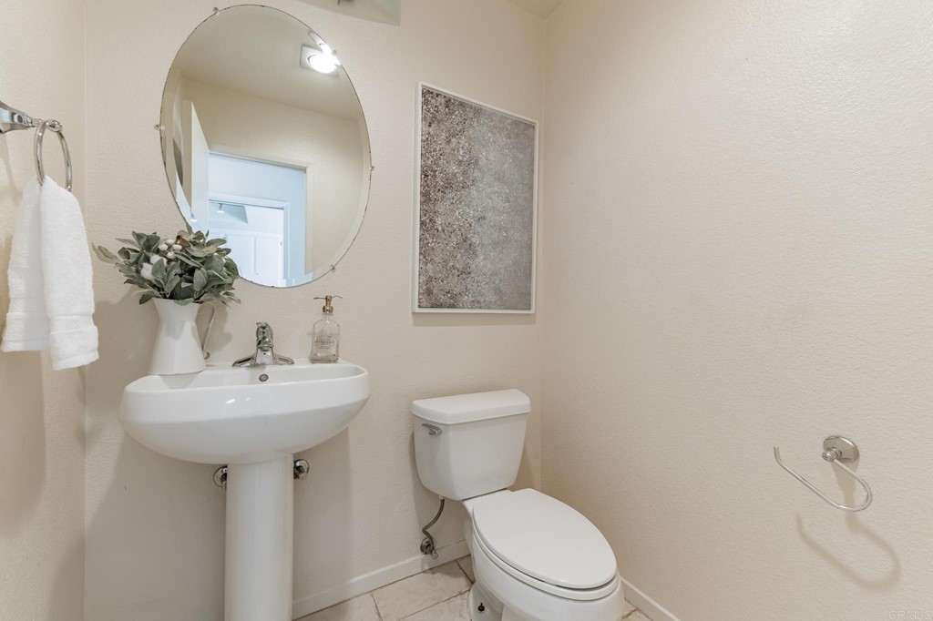 3112 Via De Caballo Encinitas, CA 92024 - Photo 7 of 31 a bathroom with a toilet sink and mirror