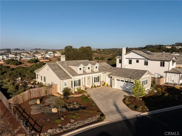 an aerial view of a house with a mountain view