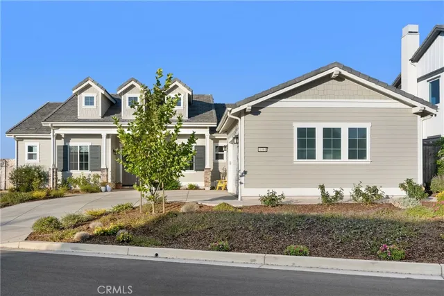 a view of a white house with large windows