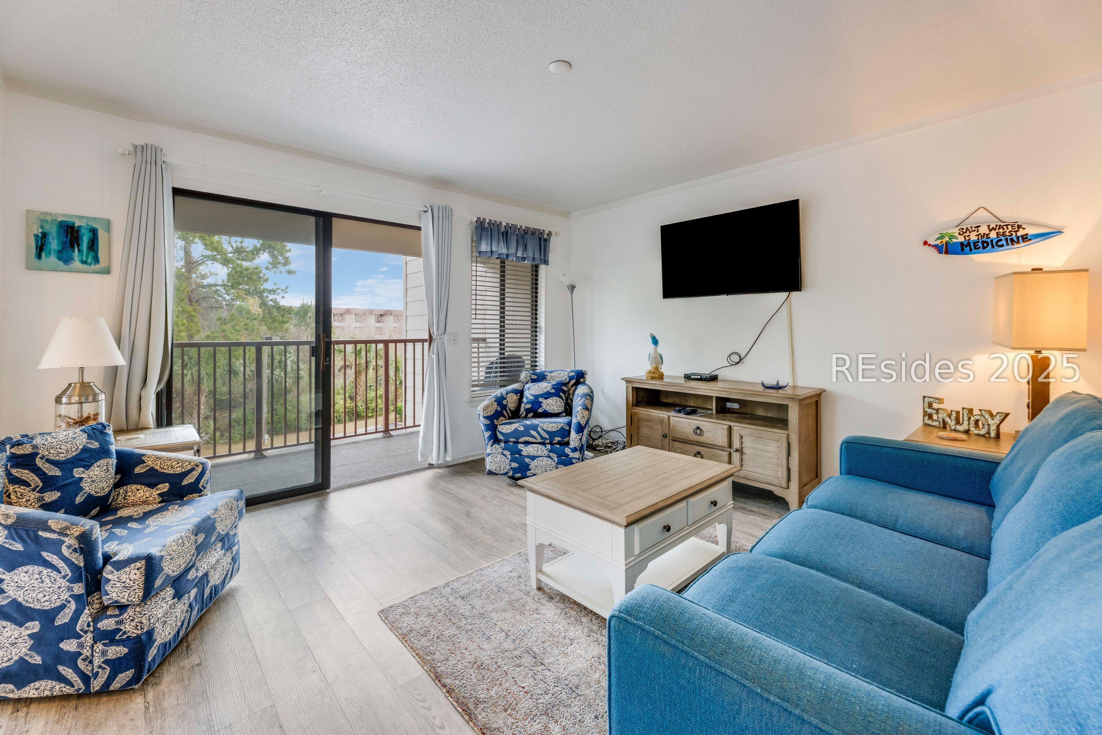 40 Folly Field Road, Unit 244 Hilton Head Island, SC 29928 - Photo 2 of 25 Living room with new furniture opens to deck.