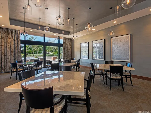 a view of a dining room with furniture window and outside view