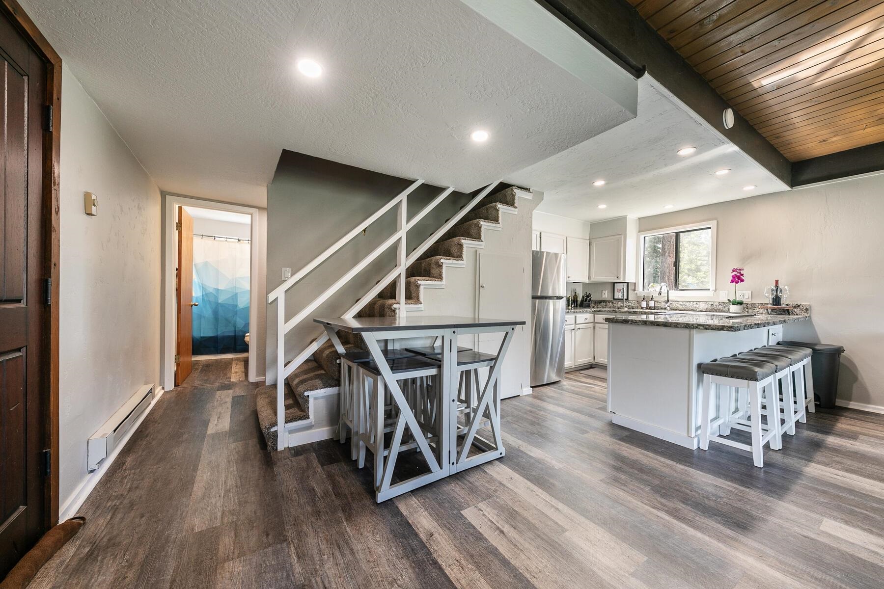 14395 South Shore Drive Truckee, CA 96161 - Photo 15 of 25 a room with wooden floors and stairs