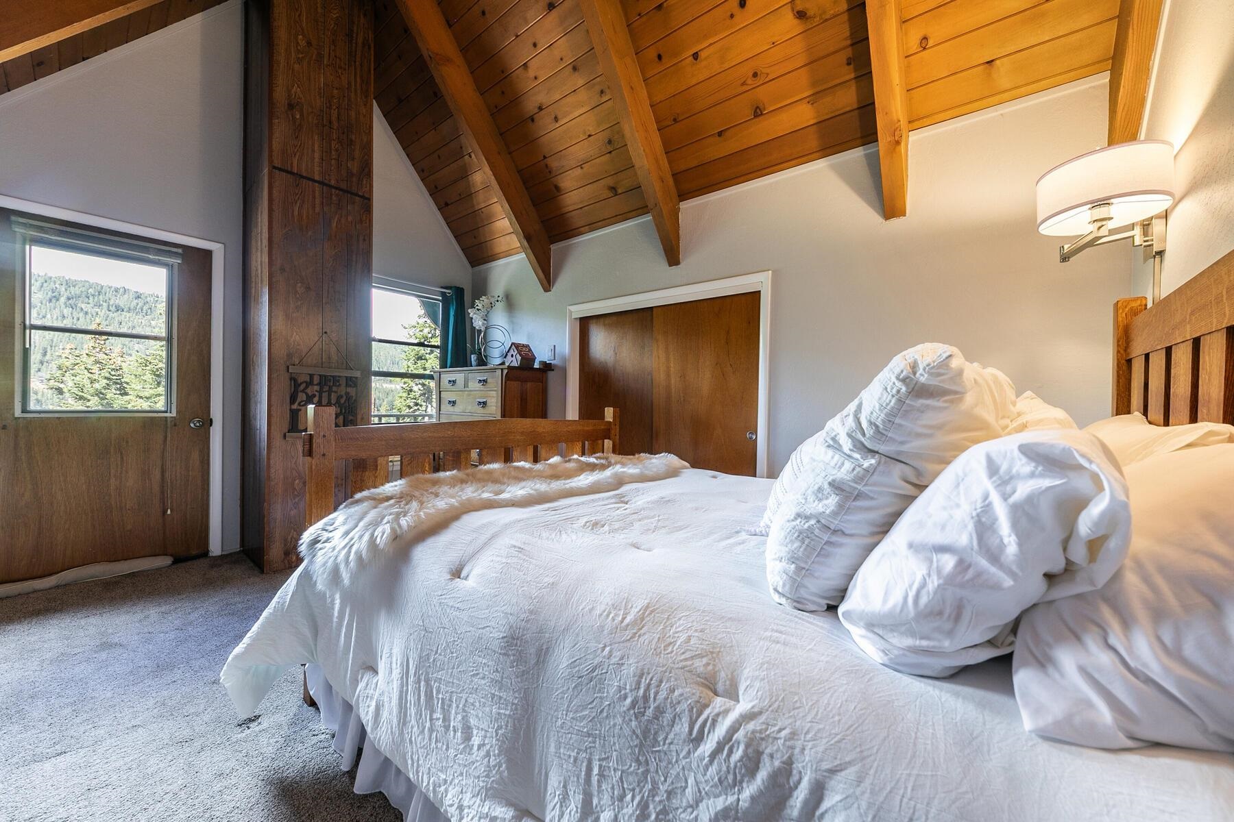 14395 South Shore Drive Truckee, CA 96161 - Photo 20 of 25 a bed sitting in a bedroom next to a window