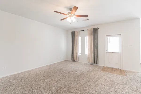 a kitchen with stainless steel appliances granite countertop a refrigerator a stove top oven a sink and dishwasher with wooden floor